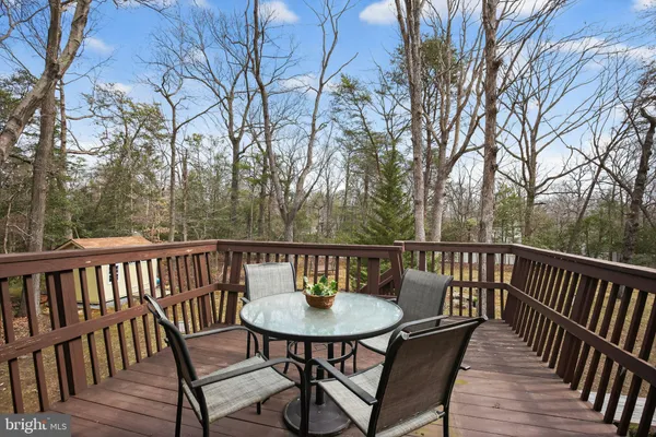 a view of a chairs and table on the deck