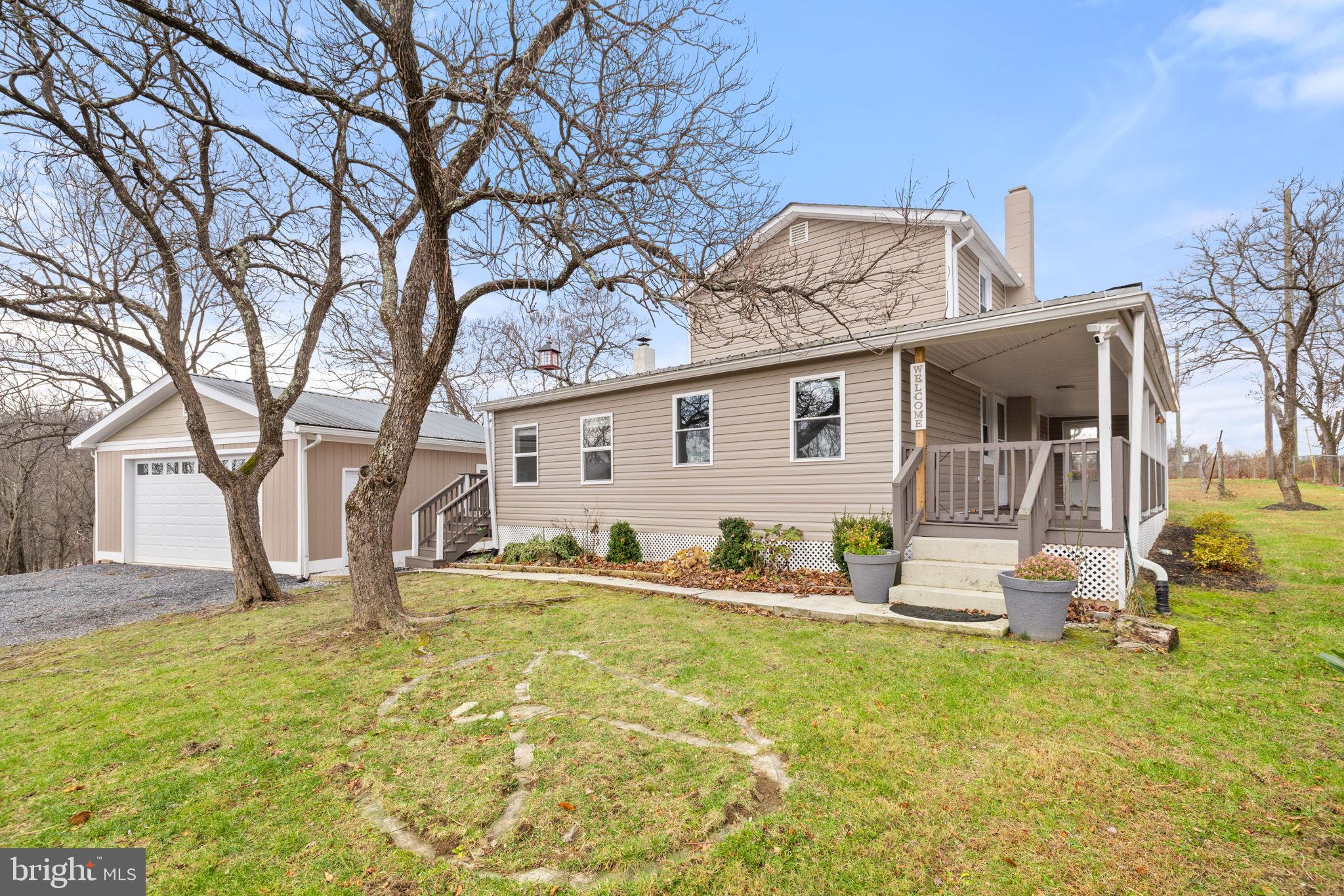 239 McDonald Road Winchester, VA 22602 - Photo 2 of 20 a front view of a house with garden