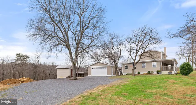 a view of house with a yard