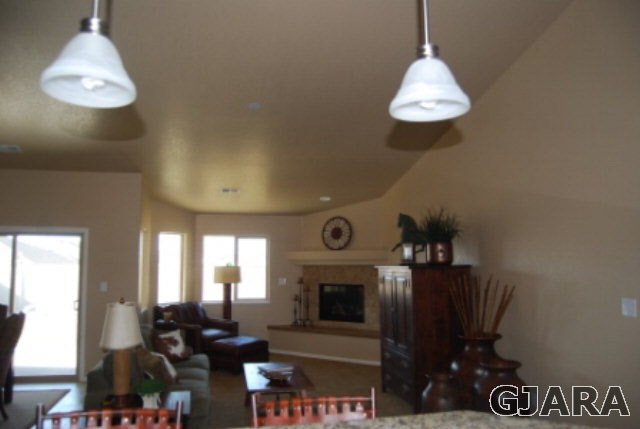 167 Red Rocks Street Fruita, CO 81521 - Photo 2 of 9 a living room with furniture and a fireplace