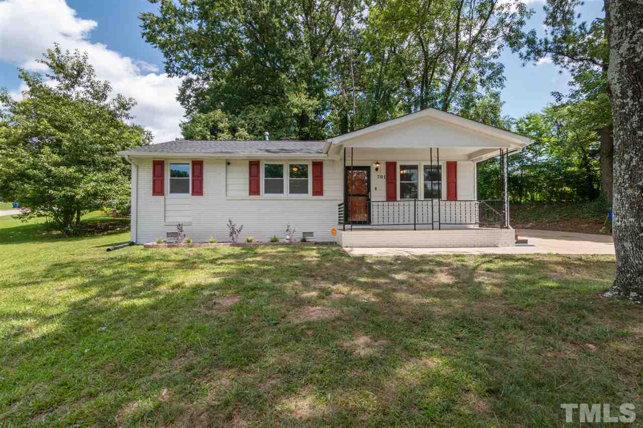 701 Hadley Road Raleigh, NC 27610 - Photo 1 of 16 a front view of a house with a garden