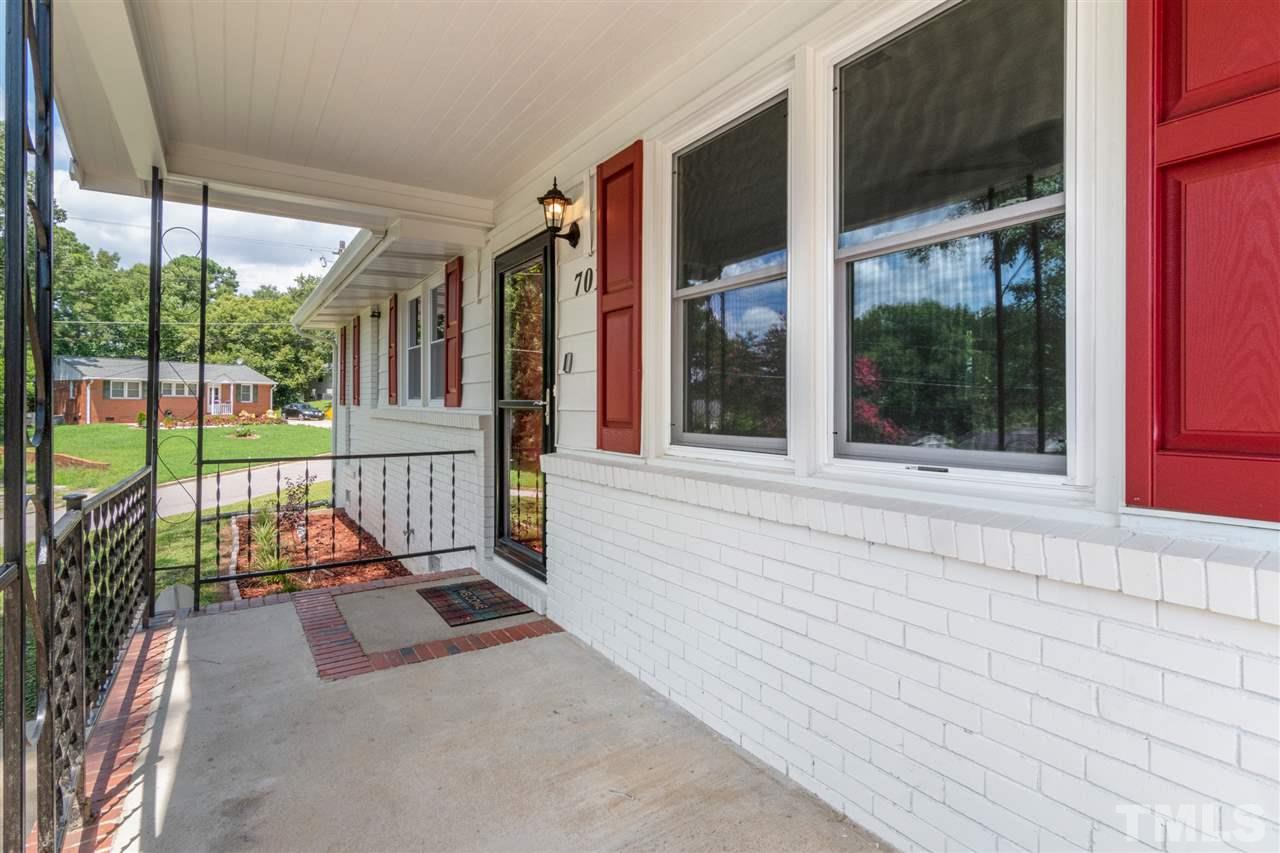 701 Hadley Road Raleigh, NC 27610 - Photo 2 of 16 a view of a room with wooden floor and iron stairs