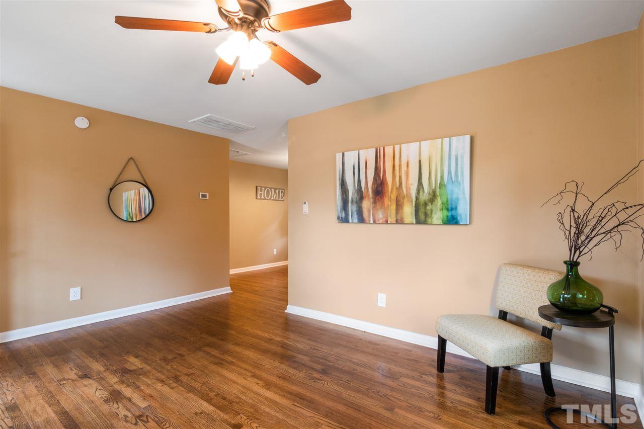 701 Hadley Road Raleigh, NC 27610 - Photo 4 of 16 a view of a livingroom with furniture and chandelier fan