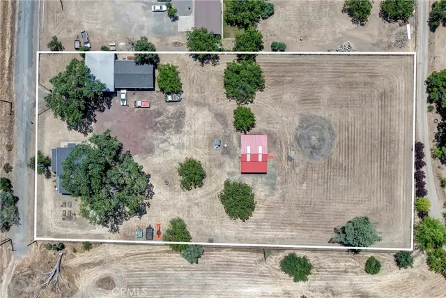 an aerial view of a house with outdoor space
