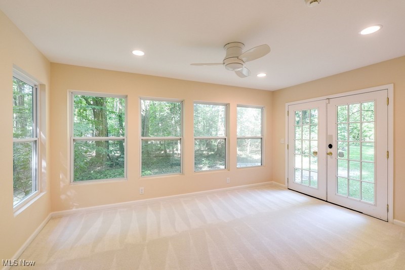 8648 Taylor May Road Chagrin Falls, OH 44023 - Photo 21 of 37 Entryway featuring light carpet, french doors, and ceiling fan