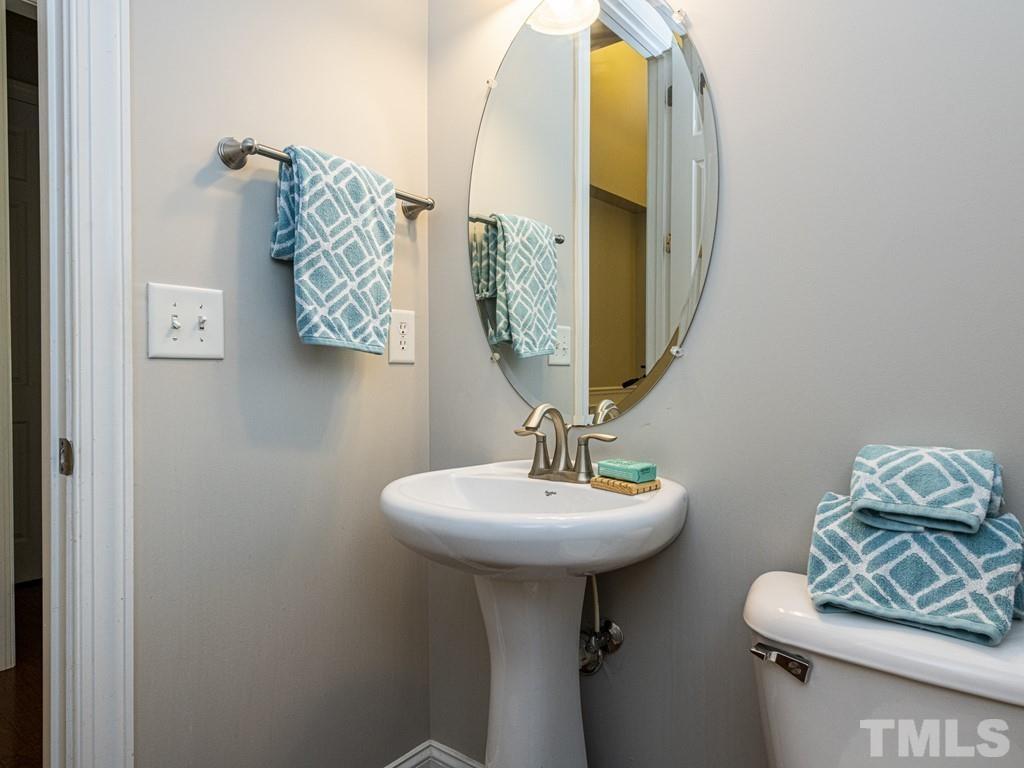1136 Chapanoke Road Raleigh, NC 27603 - Photo 19 of 30 a bathroom with a sink and a mirror