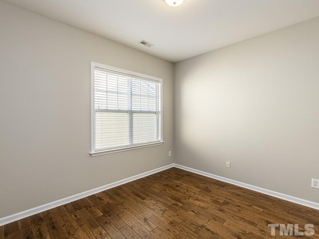 1136 Chapanoke Road Raleigh, NC 27603 - Photo 22 of 30 an empty room with wooden floor and windows