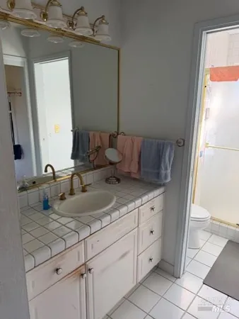 a bathroom with a sink and mirror