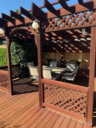 a view of a patio with wooden floor