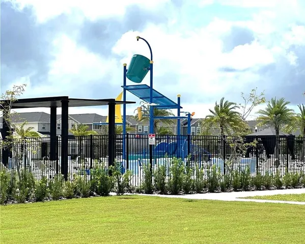 a view of a swimming pool with a yard