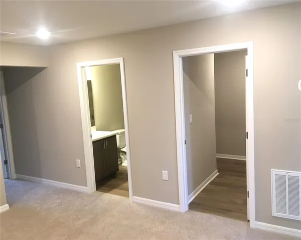 a bathroom with a toilet a sink and bathtub