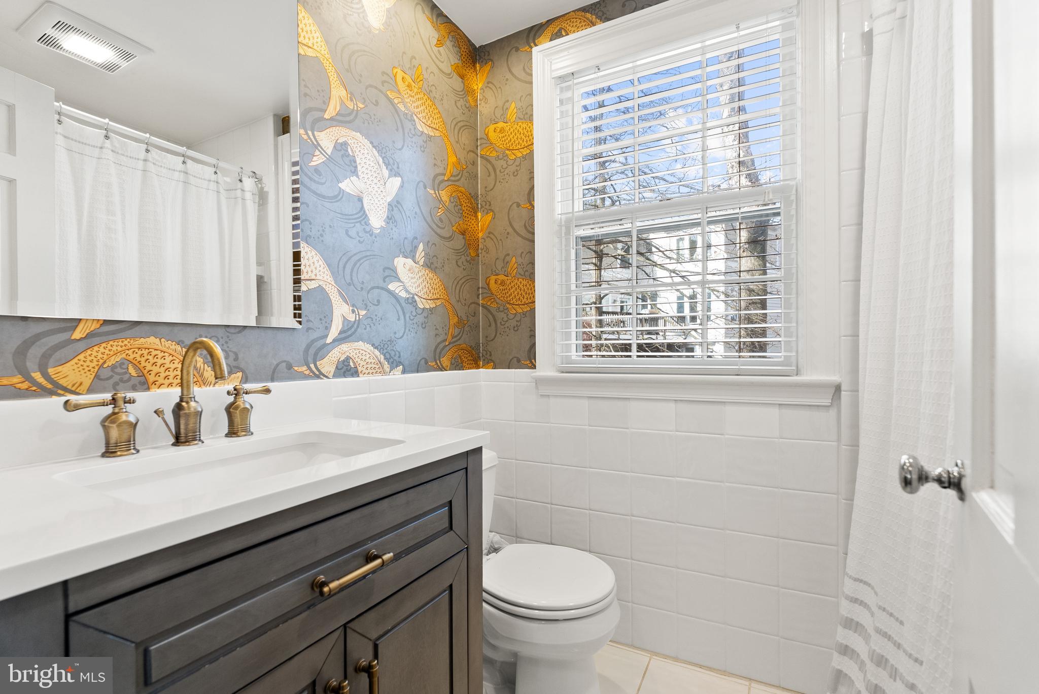 4213 Leland Street Chevy Chase, MD 20815 - Photo 20 of 33 a bathroom with a sink and a toilet