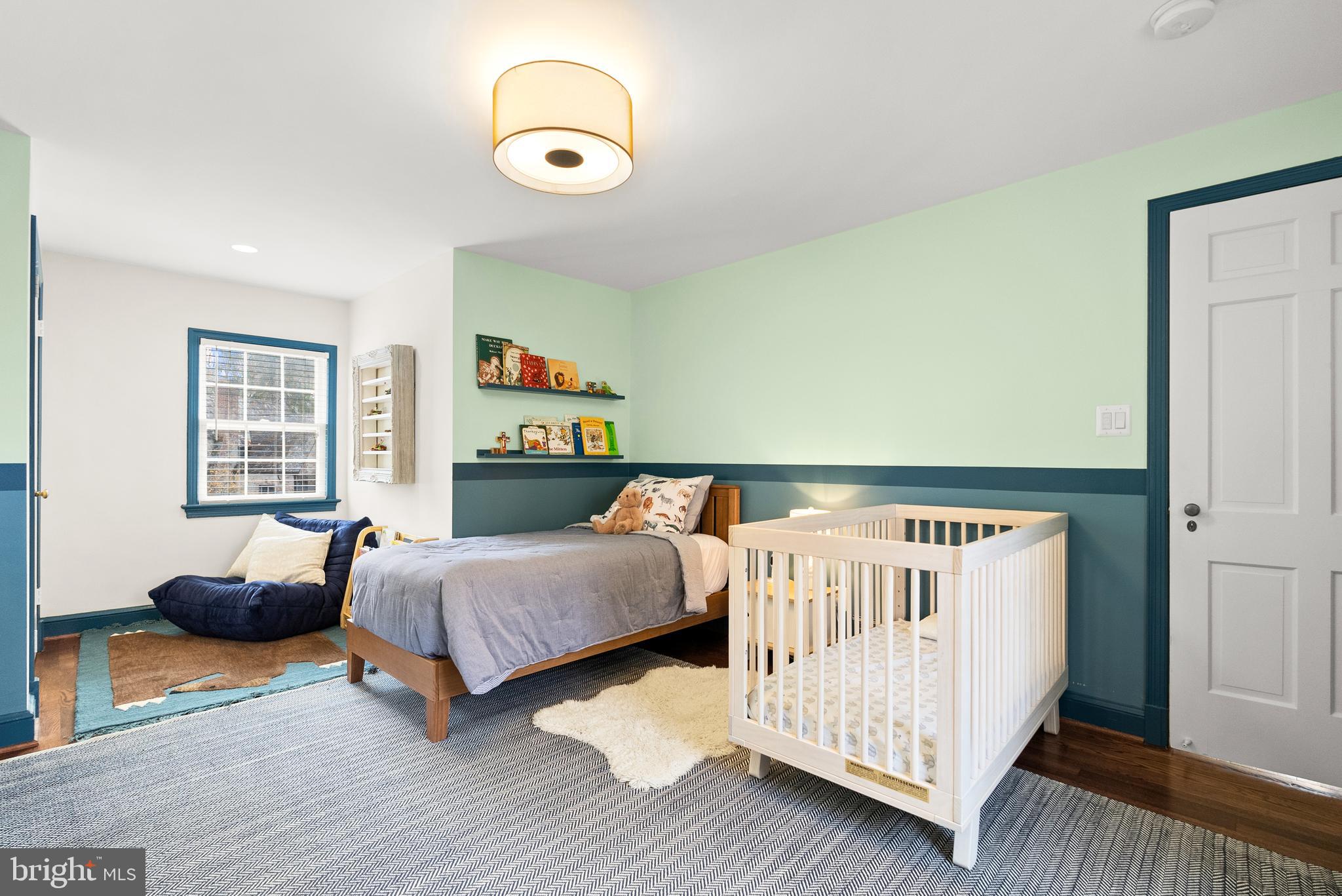 4213 Leland Street Chevy Chase, MD 20815 - Photo 22 of 33 a bedroom with furniture and a wooden floor