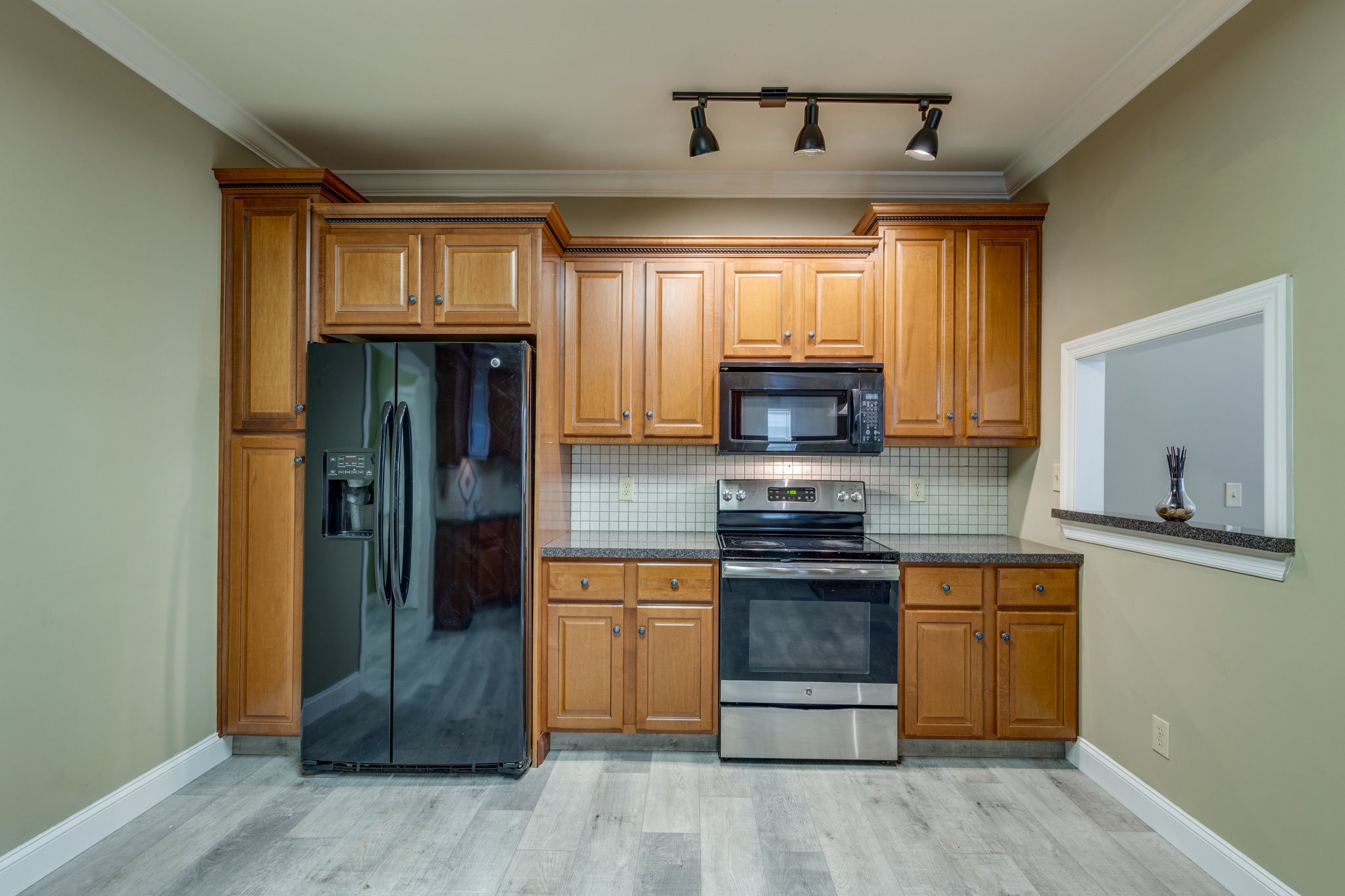4655 Hardison Mill Road Columbia, TN 38401 - Photo 11 of 47 a kitchen with stainless steel appliances granite countertop a stove and a refrigerator