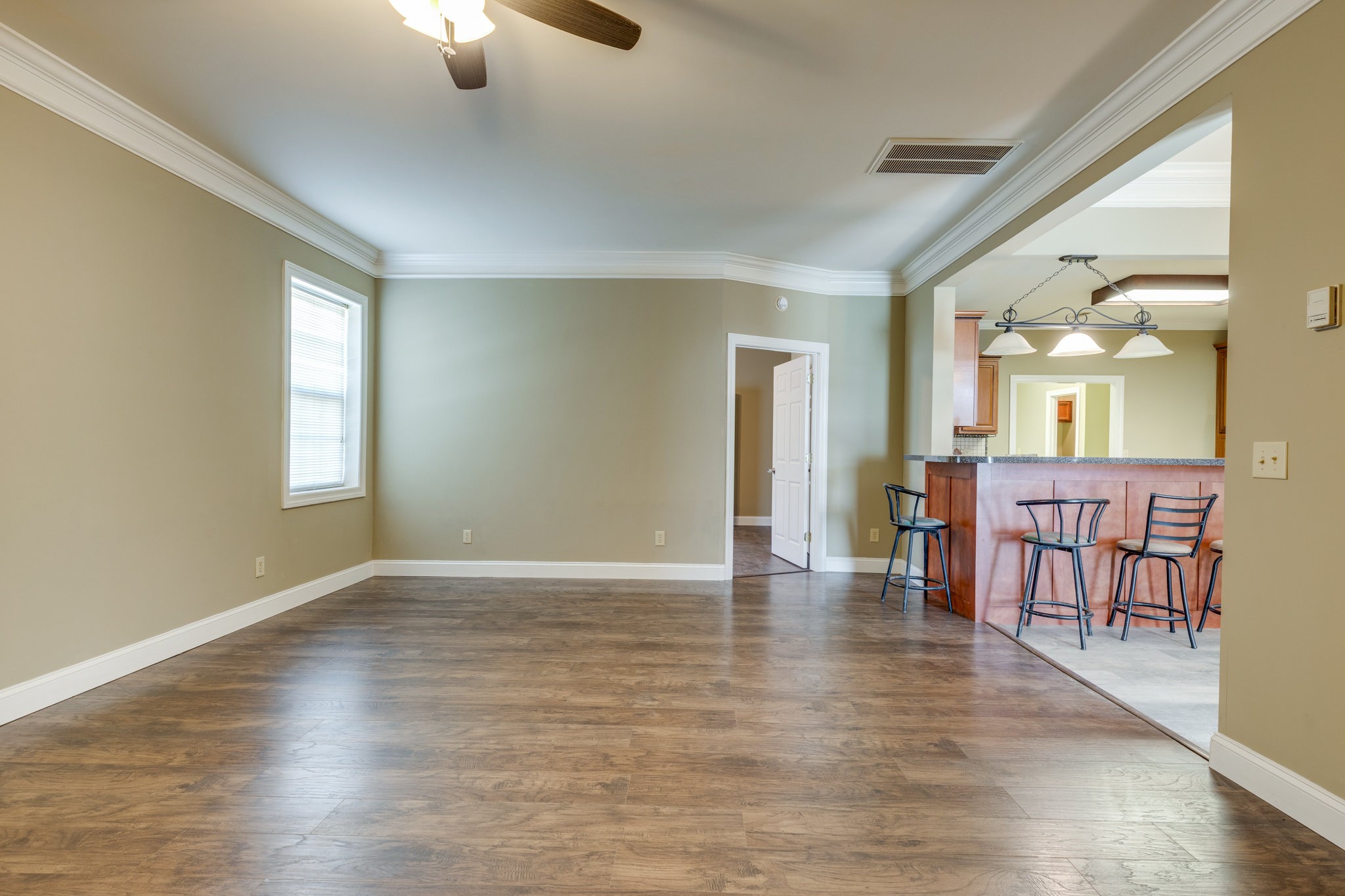4655 Hardison Mill Road Columbia, TN 38401 - Photo 14 of 47 an empty room with wooden floor and windows
