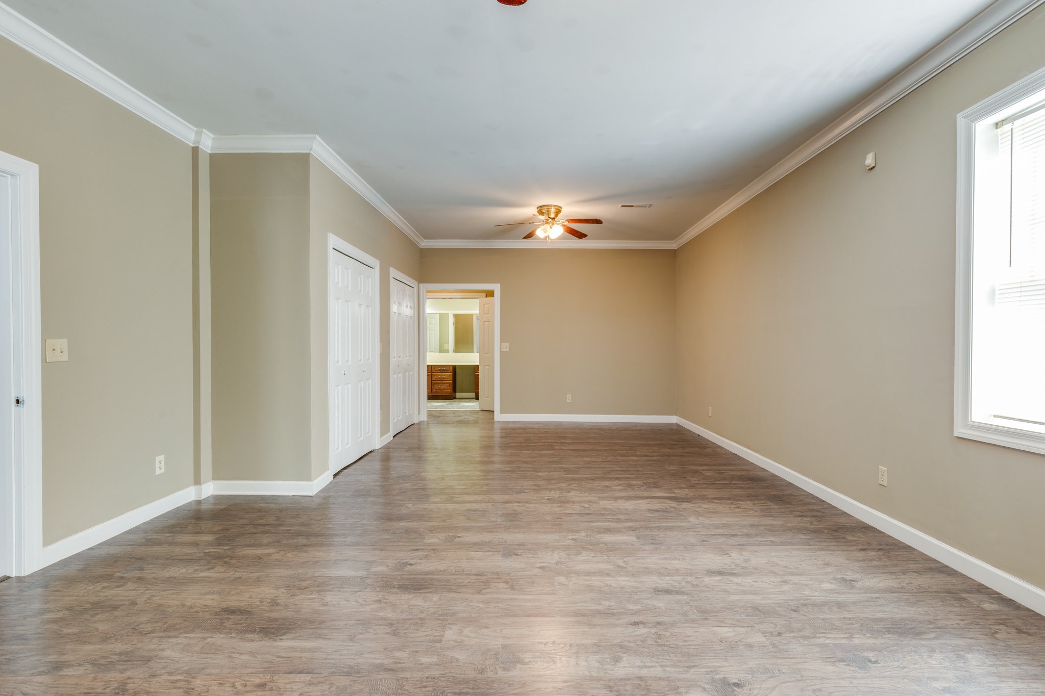 4655 Hardison Mill Road Columbia, TN 38401 - Photo 15 of 47 a view of an empty room with wooden floor and a window