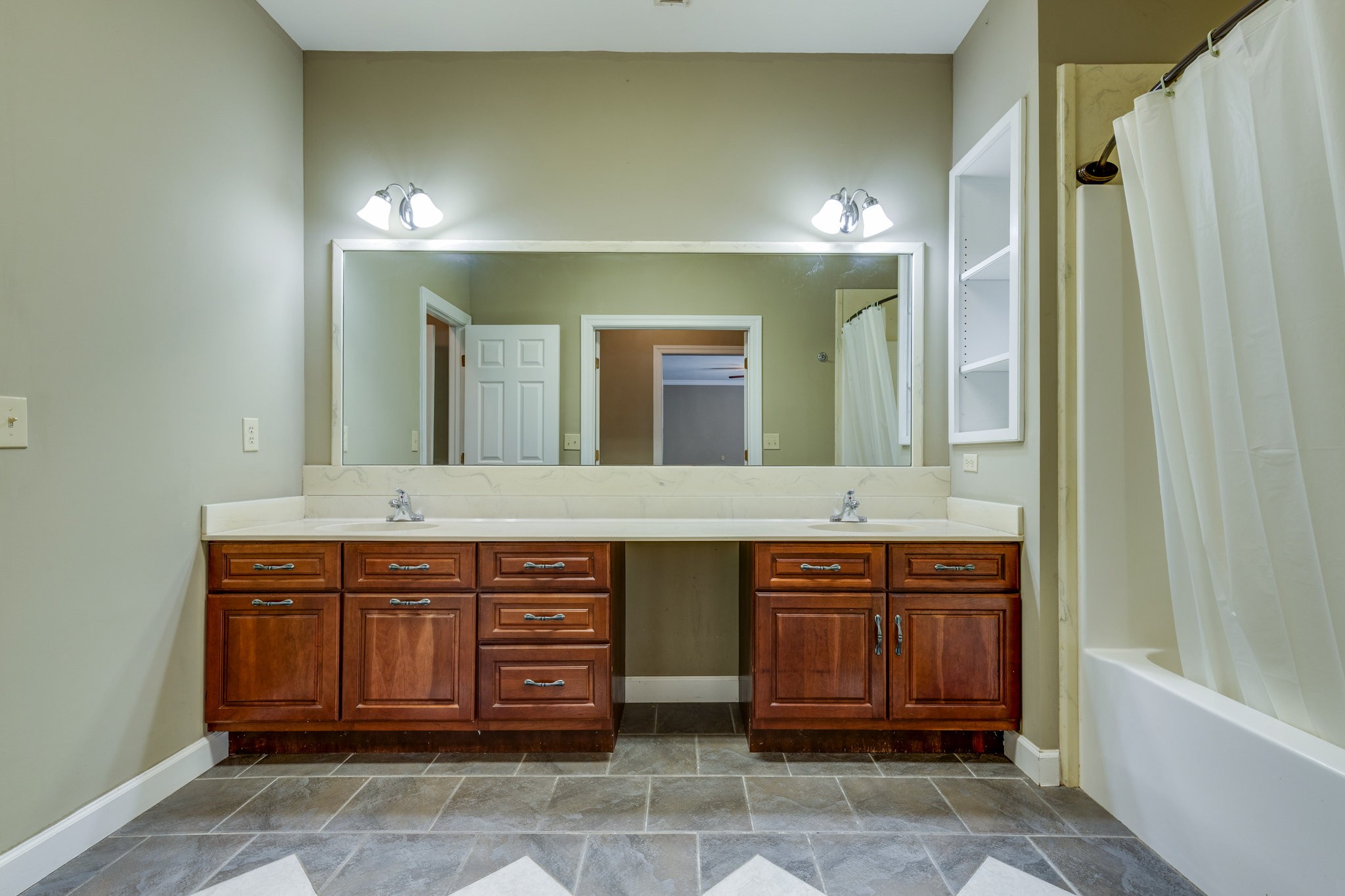 4655 Hardison Mill Road Columbia, TN 38401 - Photo 19 of 47 a spacious bathroom with a granite countertop sink and a mirror
