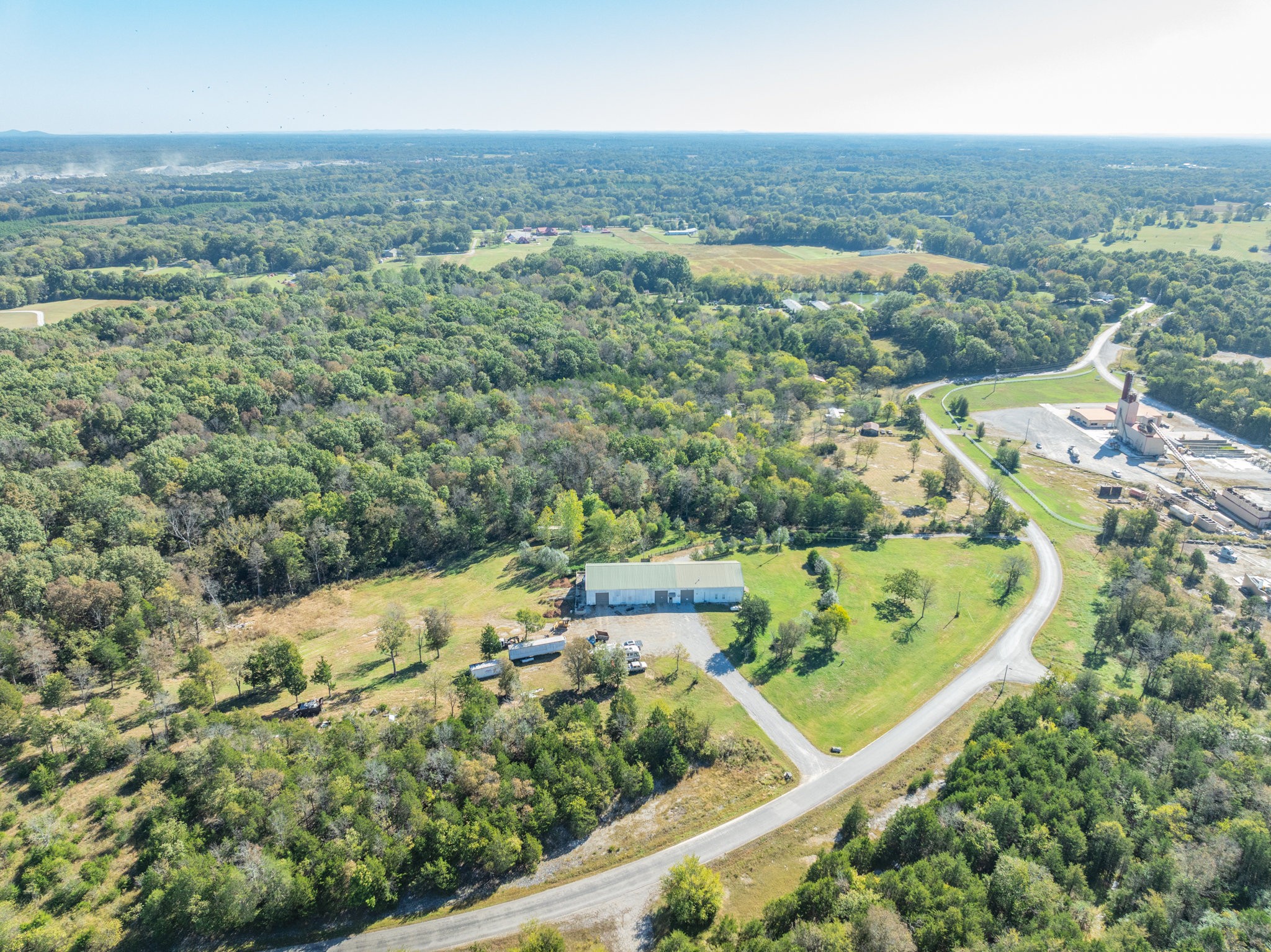4655 Hardison Mill Road Columbia, TN 38401 - Photo 37 of 47 an aerial view of residential houses with outdoor space and trees
