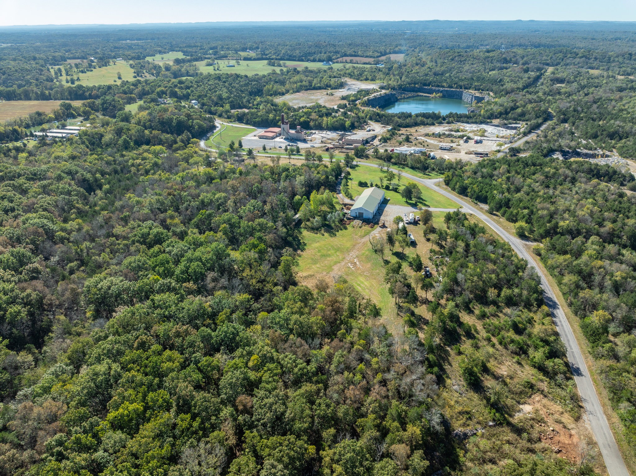 4655 Hardison Mill Road Columbia, TN 38401 - Photo 40 of 47 an aerial view of a houses with a lush green hillside
