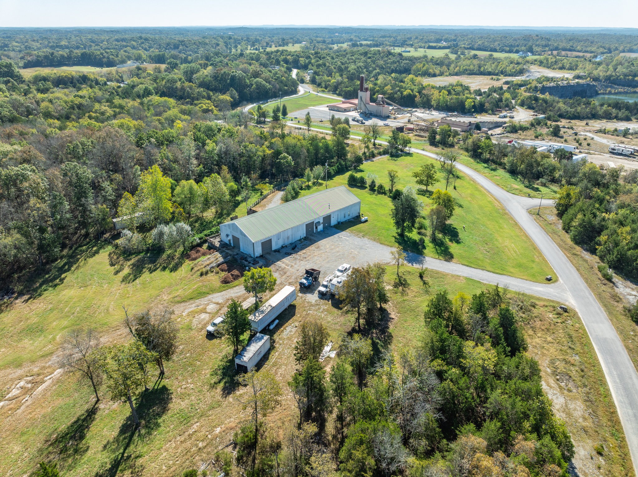 4655 Hardison Mill Road Columbia, TN 38401 - Photo 42 of 47 an aerial view of residential houses with outdoor space and trees