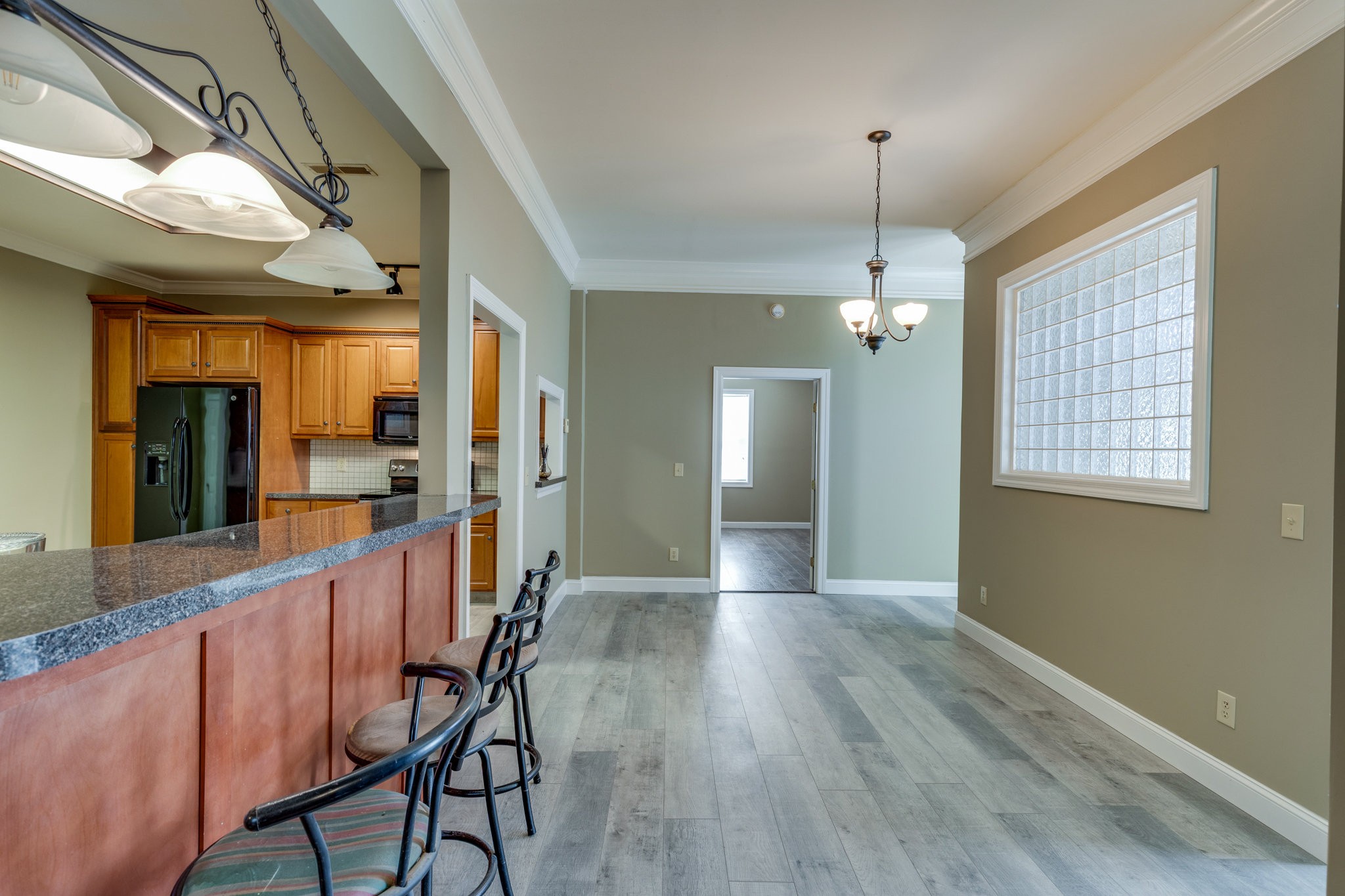 4655 Hardison Mill Road Columbia, TN 38401 - Photo 6 of 47 a view of a hallway with wooden floor and chandelier