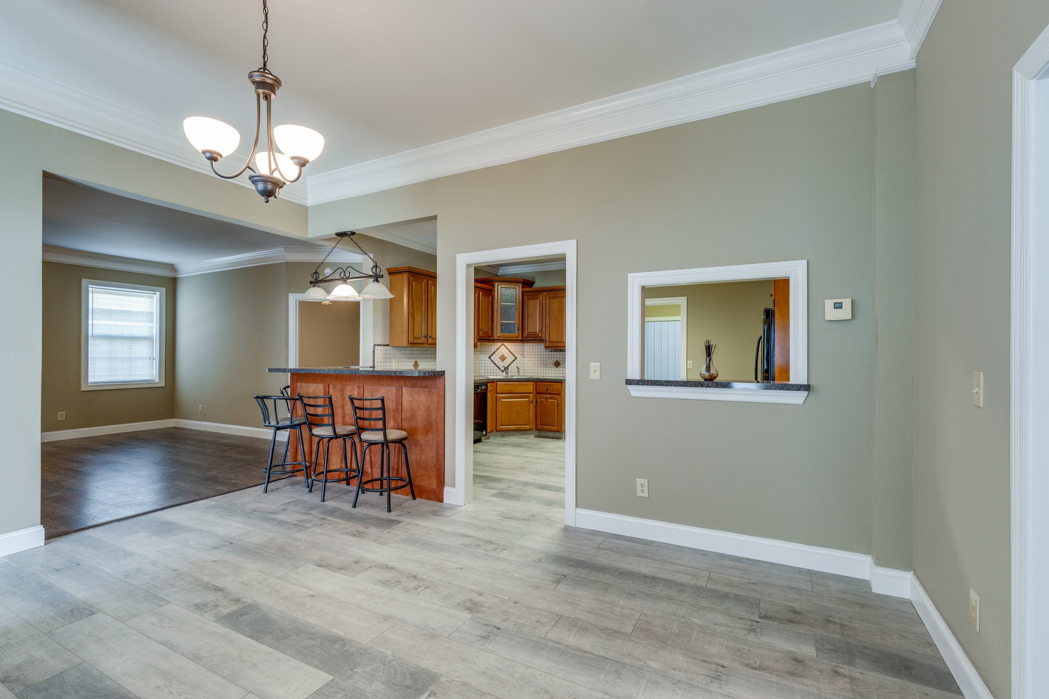 4655 Hardison Mill Road Columbia, TN 38401 - Photo 7 of 47 a view of a livingroom with furniture chandelier and wooden floor