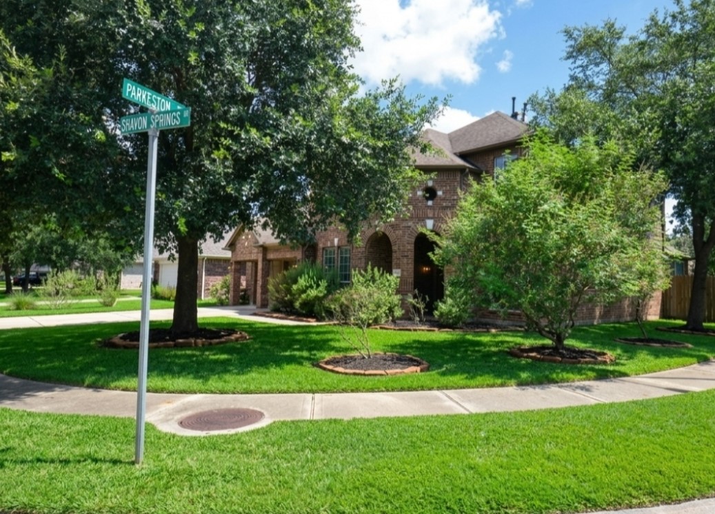 19802 Shavon Springs Drive Spring, TX 77388 - Photo 4 of 30 Lush, meticulously maintained landscaping enhances curb appeal and creates a welcoming atmosphere.
