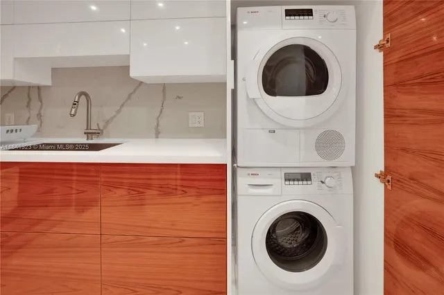 a view of a kitchen with washer and dryer