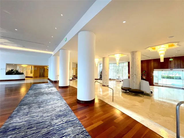 a view of a living room and dining room