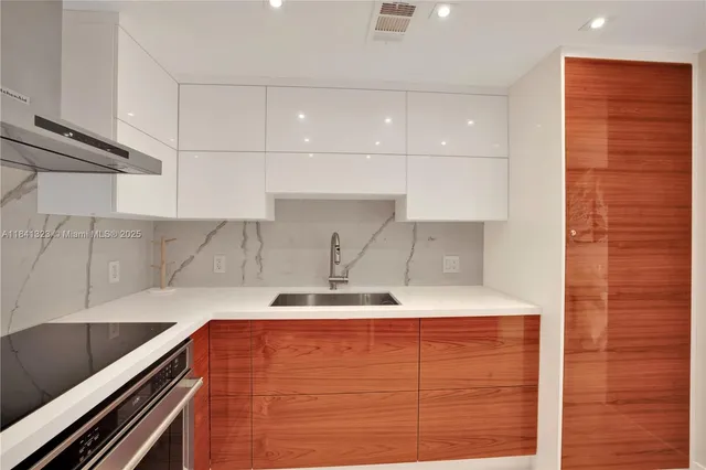 a kitchen with a sink and a stove