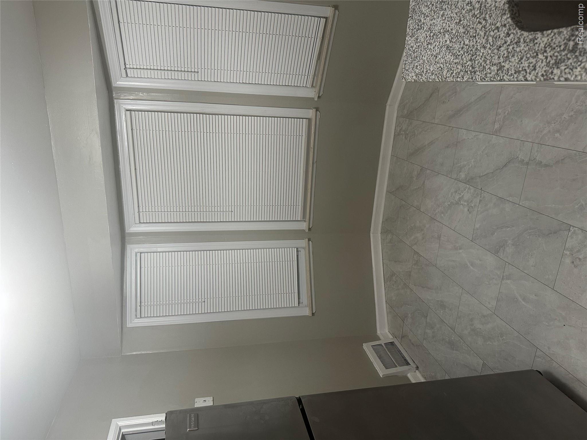 20065 Southfield Road Detroit, MI 48235 - Photo 6 of 17 Unfurnished dining area featuring baseboards