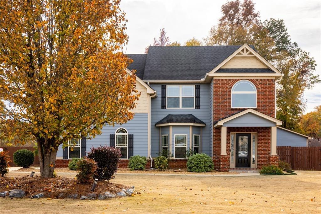 a front view of a house with a yard