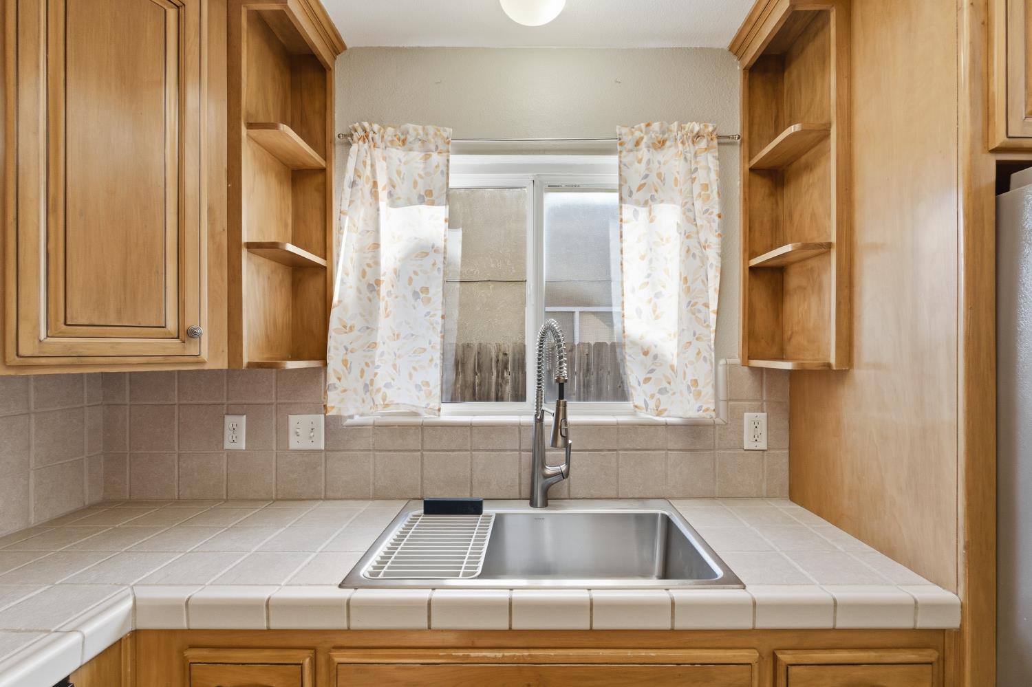 184 South Double Tree Way Madera, CA 93637 - Photo 13 of 37 a view of parking area and kitchen