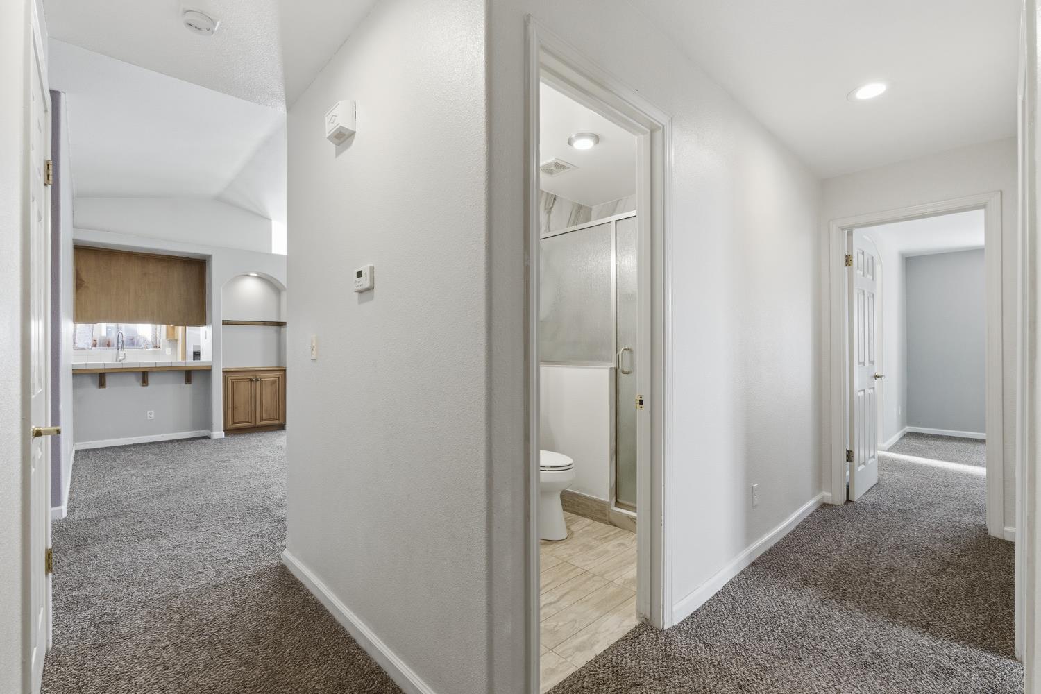 184 South Double Tree Way Madera, CA 93637 - Photo 16 of 37 a view of a bathroom from a hallway