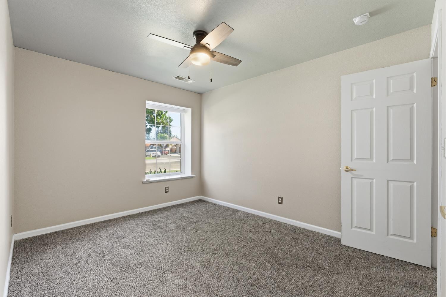 184 South Double Tree Way Madera, CA 93637 - Photo 17 of 37 a view of an empty room with a window
