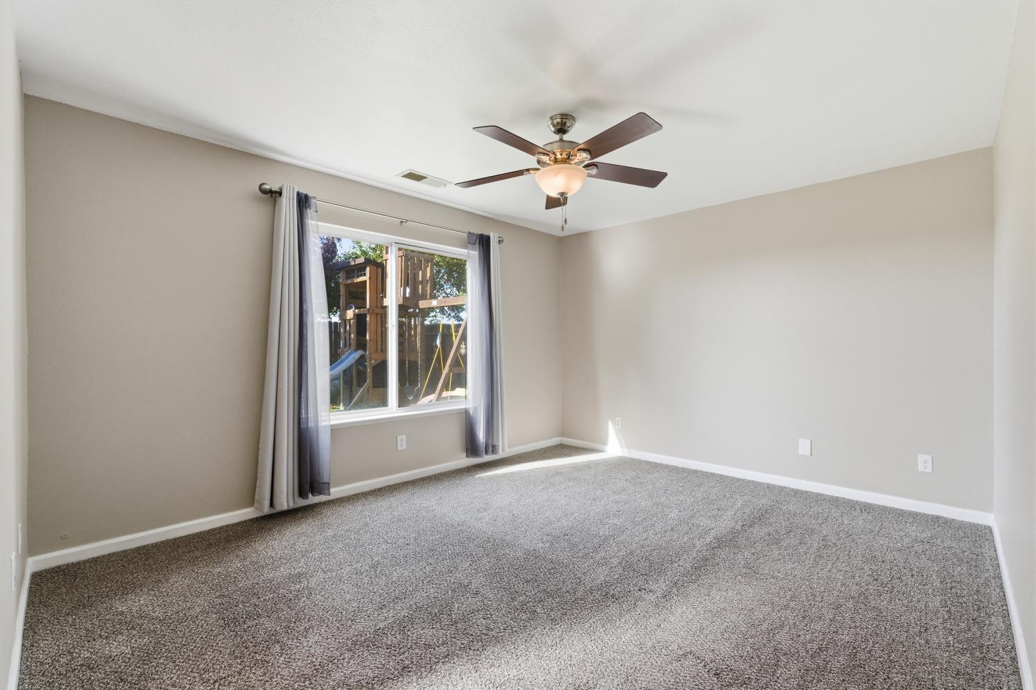 184 South Double Tree Way Madera, CA 93637 - Photo 19 of 37 a view of an empty room with a window