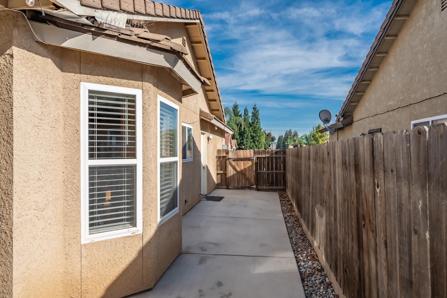 184 South Double Tree Way Madera, CA 93637 - Photo 24 of 37 a view of a house with a wooden fence