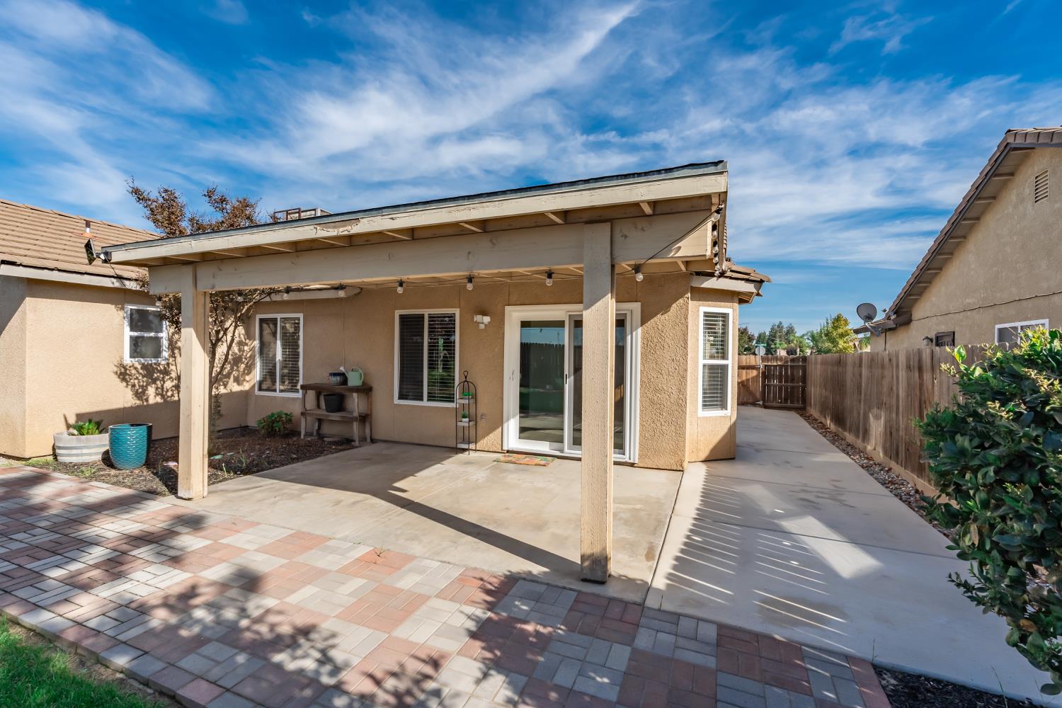 184 South Double Tree Way Madera, CA 93637 - Photo 25 of 37 a view of a house with backyard porch and sitting area