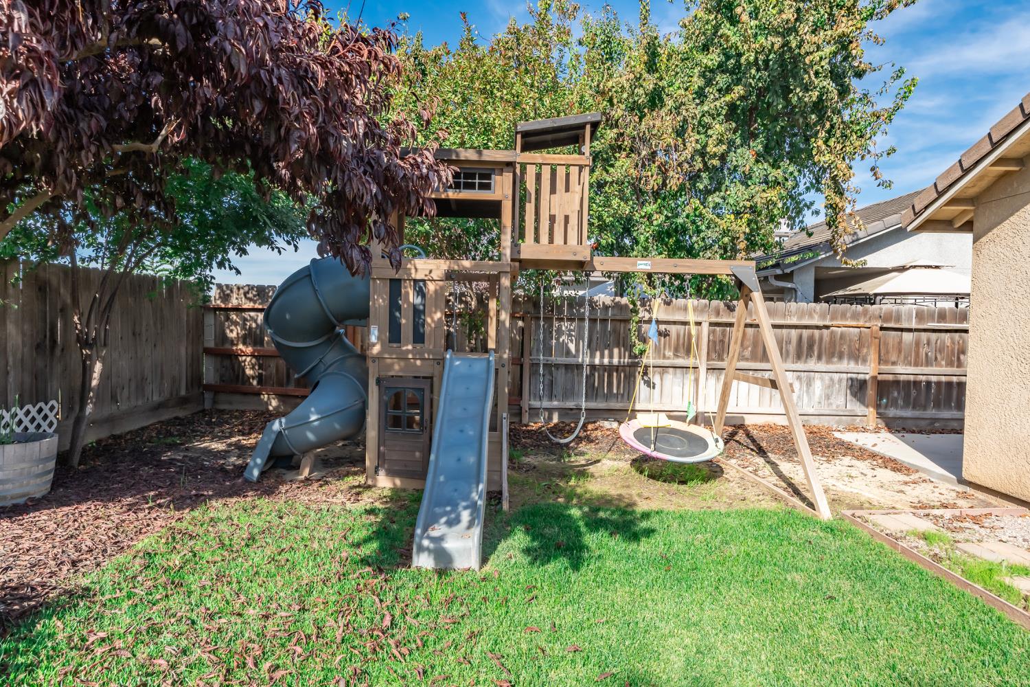 184 South Double Tree Way Madera, CA 93637 - Photo 28 of 37 a view of a house with backyard and porch