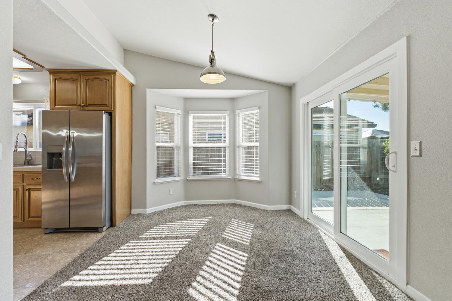 184 South Double Tree Way Madera, CA 93637 - Photo 8 of 37 a view of a room window and wooden floor