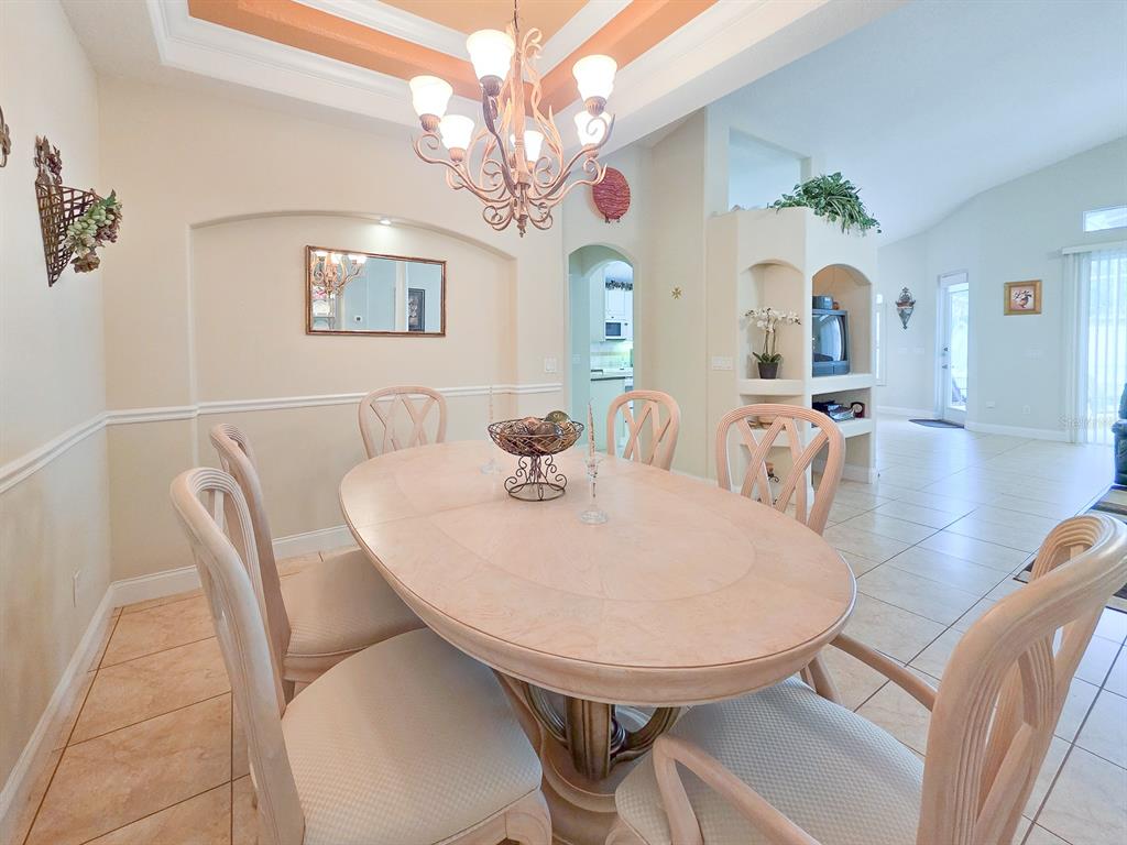 1 Ripley Place Palm Coast, FL 32164 - Photo 11 of 54 a view of a dining room with furniture and chandelier