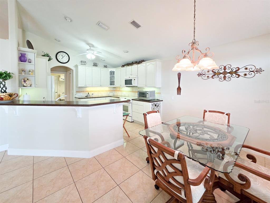 1 Ripley Place Palm Coast, FL 32164 - Photo 17 of 54 a kitchen with a table and chairs in it