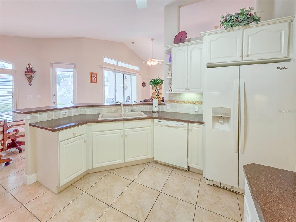 1 Ripley Place Palm Coast, FL 32164 - Photo 19 of 54 a kitchen with cabinets and window