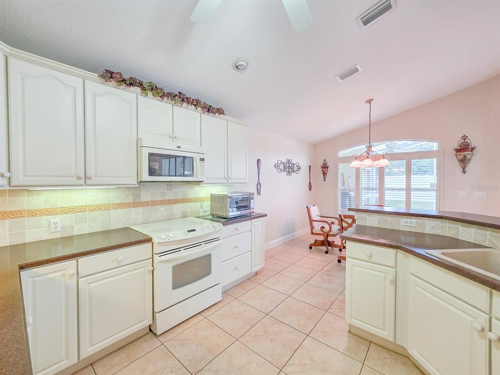 1 Ripley Place Palm Coast, FL 32164 - Photo 20 of 54 a kitchen that has a sink and a stove in it