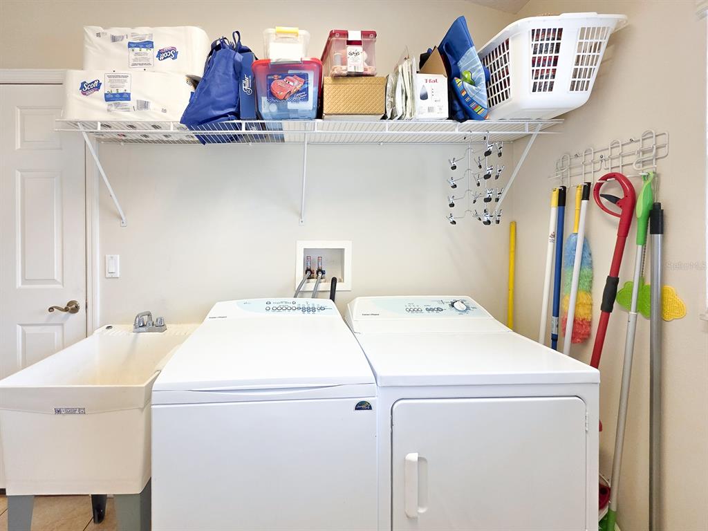 1 Ripley Place Palm Coast, FL 32164 - Photo 23 of 54 a utility room with dryer and washer