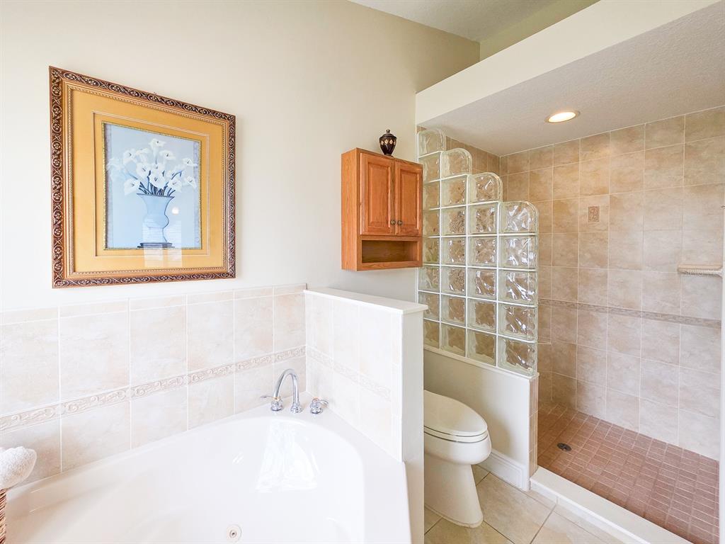 1 Ripley Place Palm Coast, FL 32164 - Photo 30 of 54 a bathroom with a toilet sink and shower