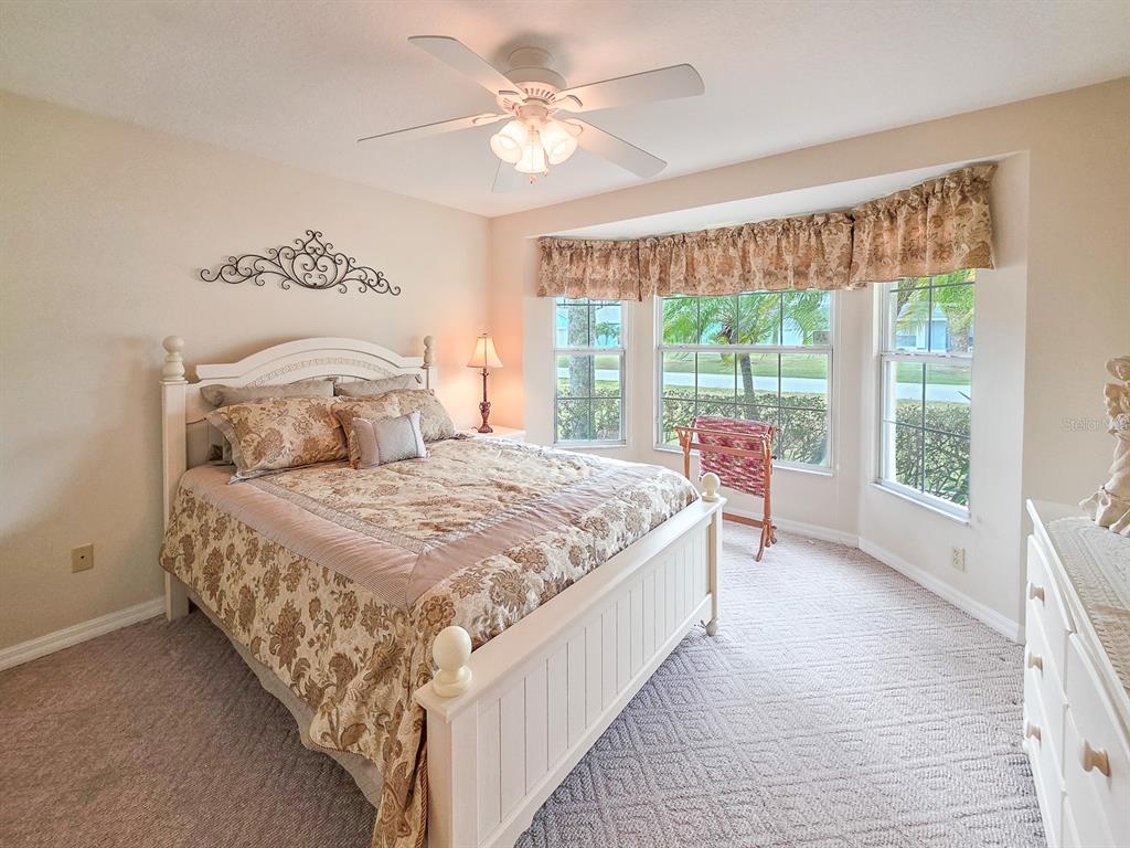 1 Ripley Place Palm Coast, FL 32164 - Photo 32 of 54 a bedroom with a large bed and a large window