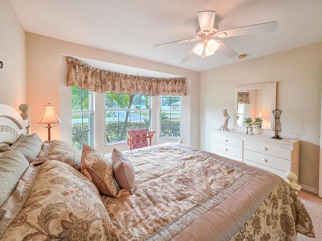 1 Ripley Place Palm Coast, FL 32164 - Photo 33 of 54 a bedroom with a large bed and a window