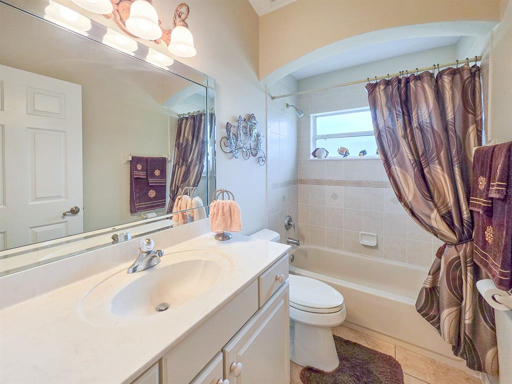 1 Ripley Place Palm Coast, FL 32164 - Photo 35 of 54 a bathroom with a sink a toilet and a bathtub
