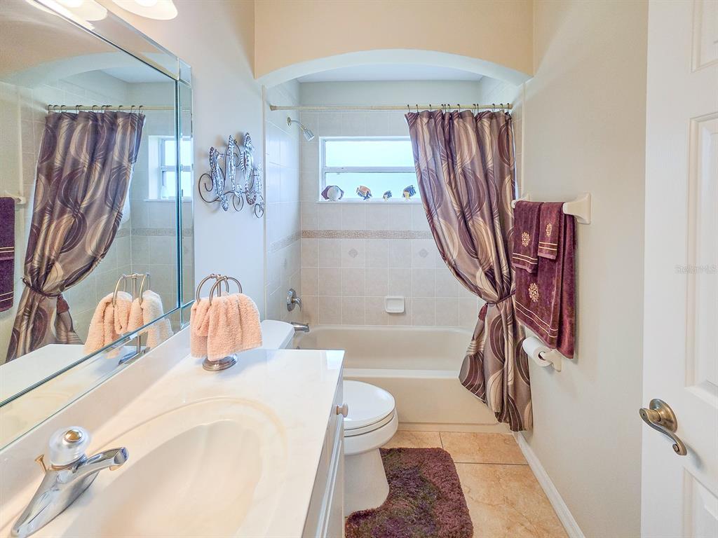 1 Ripley Place Palm Coast, FL 32164 - Photo 36 of 54 a bathroom with a granite countertop sink toilet and shower